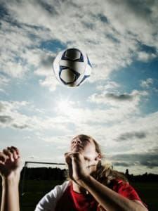 Teen female athlete playing soccer