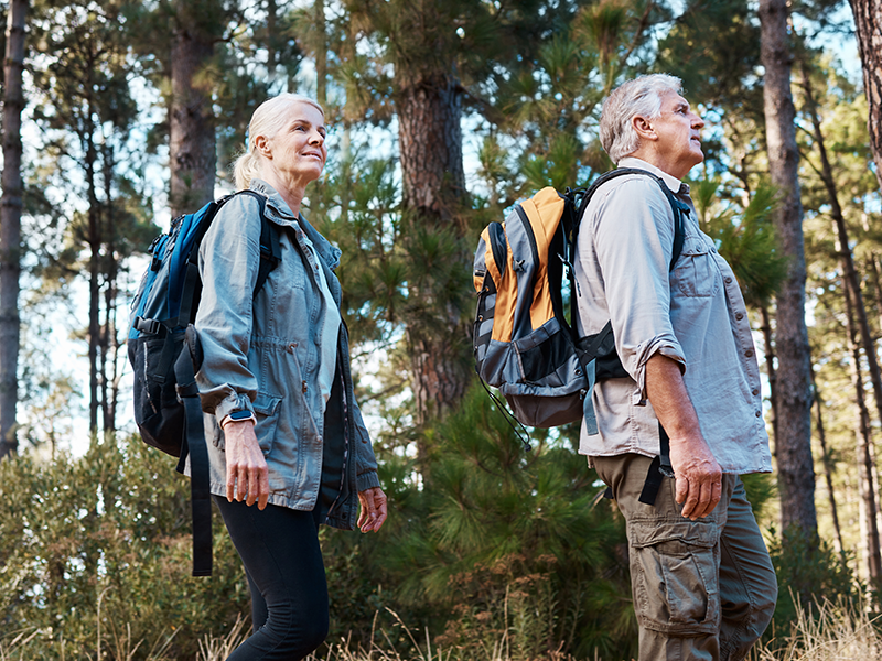 Couple walking through forest