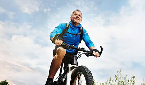 Older man mountain biking